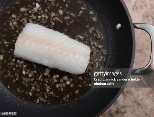 codfish being fried. - pacific cod foto e immagini stock