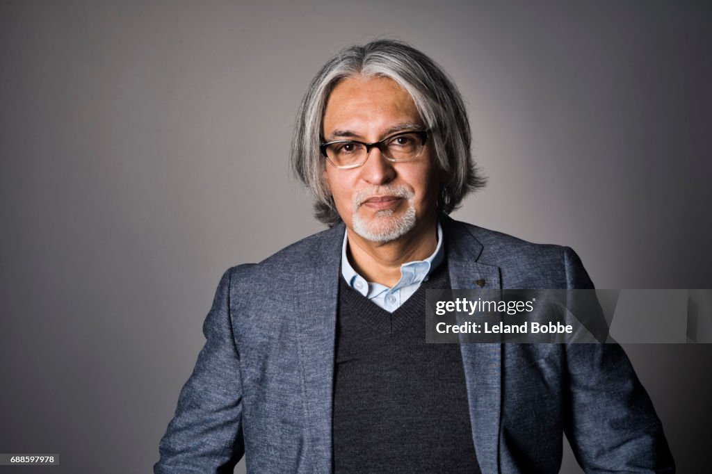 Portrait of Middle Aged Hispanic Man with Long  Gray Hair