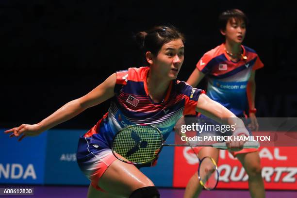 Woon Khe Wei and Vivian Hoo of Malaysia play a return during their women's doubles Sudirman Cup match against Japan's Misaki Matsutomo and Ayaka...