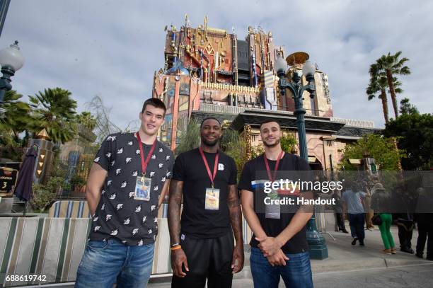 In this handout photo provided by Disney Resorts, Ivica Zubac, Tarik Black and Larry Nance, Jr. Of the Los Angeles Lakers attend the grand opening of...