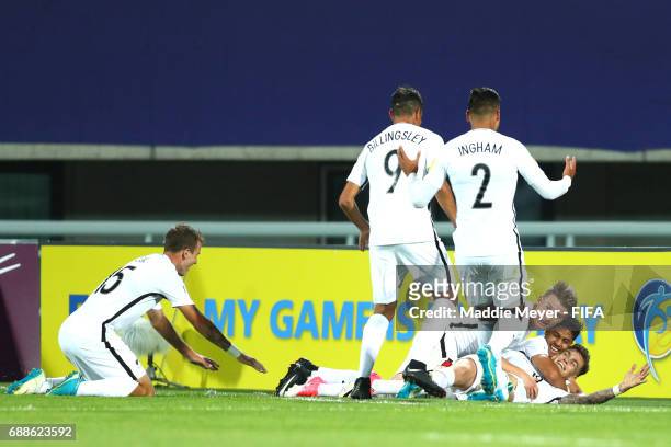 Myer Bevan of New Zealand celebrates with James McGarry, Dane Ingham, and Noah Billingsley after scoring the teams third goal during the FIFA U-20...