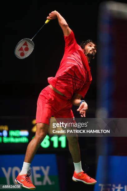 India's Srikanth Kidambi hits a shot during his men's singles Sudirman Cup badminton match against Chen Long of China at the Gold Coast Sports Centre...