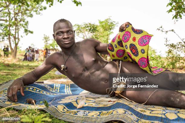 For the Yom tribe, the circumcision ceremony is a very important rite of passage from boys to men. A man circumcised in a traditional ceremony shows...