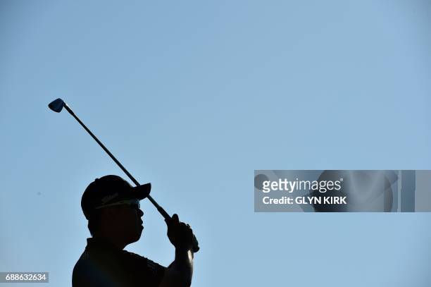 Korean golfer Byeong Hun An watches his drive from the second tee on the second day of the golf PGA Championship at Wentworth Golf Club in Surrey,...