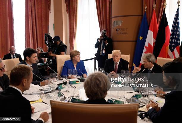 From C, clockwise: German Chancellor Angela Merkel, US President Donald Trump, Italian Prime Minister Paolo Gentiloni, Japanese Prime Minister Shinzo...