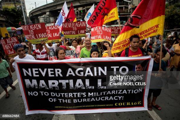 Activists march to Mendiola near the Malacanang Palace in Manila on May 26 condemning the government's martial law implemention. Former President...