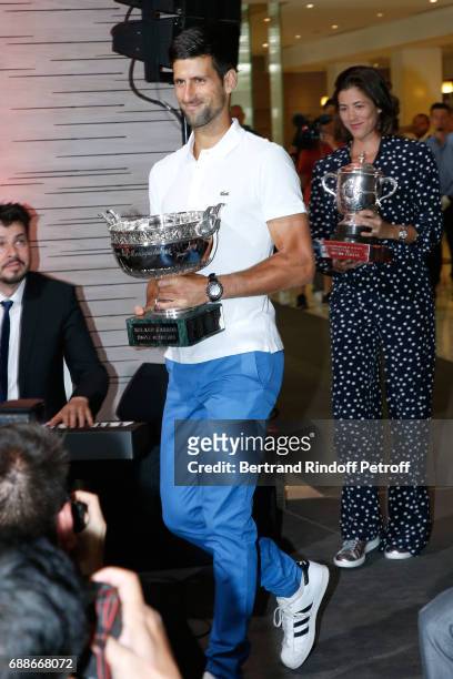 Winner of Roland Garros 2016 , Novak Djokovic and Spanish Winner of Roland Garros 2016 , Garbine Muguruza attend the 2017 Roland Garros French Tennis...