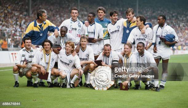 Winners Leeds United including Eric Cantona David Rocastle Gary Speed Gordon Strachan celebrate after the FA Charity Shield between Leeds United and...