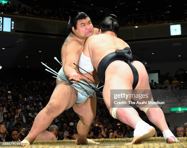 Sekiwake Takayasu and Mongolian yokozuna Harumafuji compete during day thirteen of the Grand Sumo Summer Tournament at Ryogoku Kokugikan on May 26,...