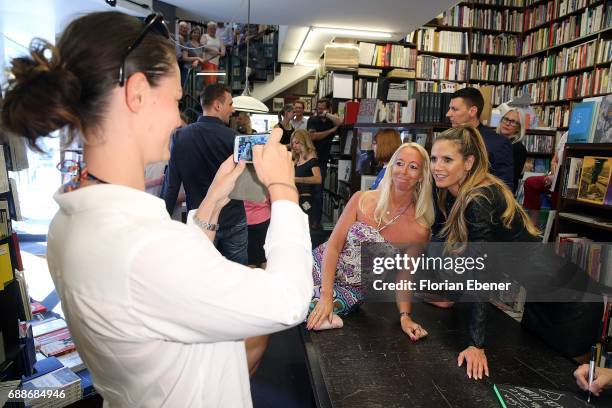 Heidi Klum celebrates the release of the new book 'Heidi Klum By Rankin' at Walter Koenig book store on May 26, 2017 in Cologne, Germany.