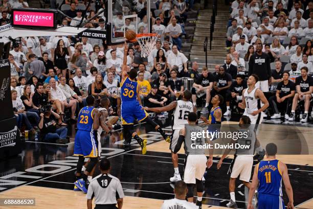 Stephen Curry of the Golden State Warriors drives to the basket against the San Antonio Spurs in Game Four of the Western Conference Finals during...