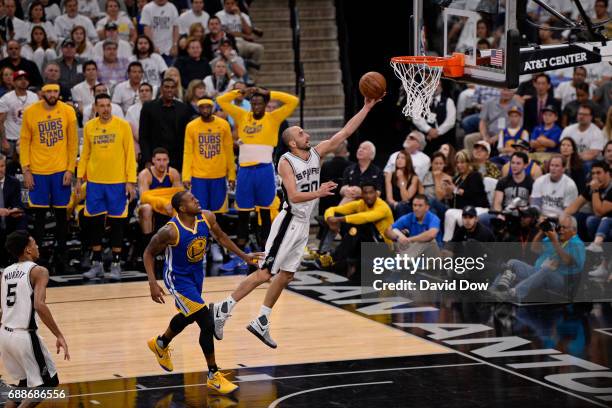 Manu Ginobili of the San Antonio Spurs drives to the basket against the Golden State Warriors in Game Four of the Western Conference Finals during...