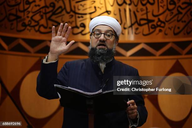 Imam, Irfan Chishti addresses worshippers as they attend Friday prayers at Manchester Central Mosque where they prayed for the victims and injured in...