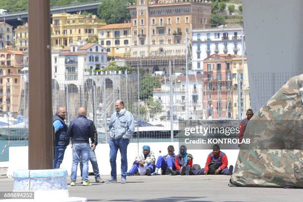 Some migrants during stages of landing from The Ship, Acquarius, of Italian-Franco-German humanitarian organization «Sos Mediterranee» in partnership...