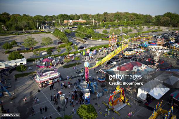 Carnival rides and games stand in the parking lot of the Marley Station Mall during the Dreamland Amusements carnival in Glen Burnie, Maryland, U.S.,...