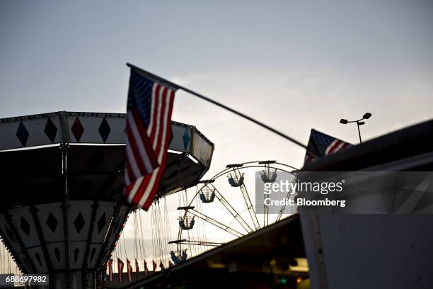The Dream Wheel stands past an American flag in the parking lot of the Marley Station Mall during the Dreamland Amusements carnival in Glen Burnie,...