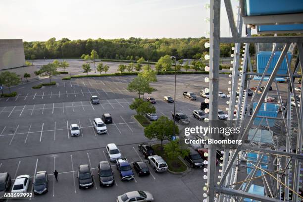 Vehicles sit in the parking lot of the Marley Station Mall next to Dream Wheel during the Dreamland Amusements carnival in Glen Burnie, Maryland,...