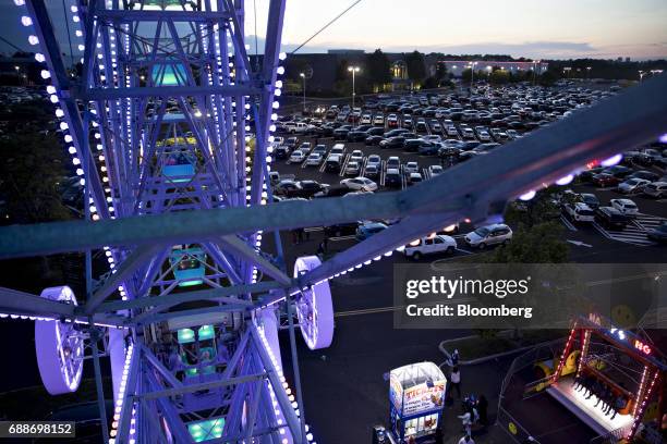 The Neshaminy Mall and parking lot stands past the Dream Wheel ride during the Dreamland Amusements carnival in Bensalem, Pennsylvania, U.S., on...