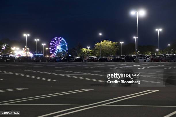 The Dream Wheel ride stands in the parking lot of the Neshaminy Mall during the Dreamland Amusements carnival in Bensalem, Pennsylvania, U.S., on...