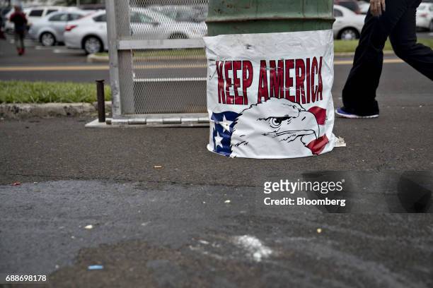 Keep America" sign covers a trash can during the Dreamland Amusements carnival in the parking lot of the Neshaminy Mall in Bensalem, Pennsylvania,...