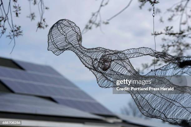 Wonder Woman Magic Carpet Rider by Jean Noon, aluminum wire and stone, part of the Power of Place exhibit at Laudholm Farm in Wells, photographed on...