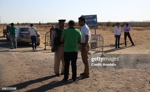 Egyptian security forces take security measures at the entrance of St. Samuels Monastery, after the attackers opened fire on a bus carrying Coptic...