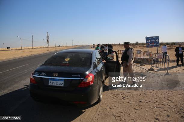 Egyptian security forces take security measures at the entrance of St. Samuels Monastery, after the attackers opened fire on a bus carrying Coptic...