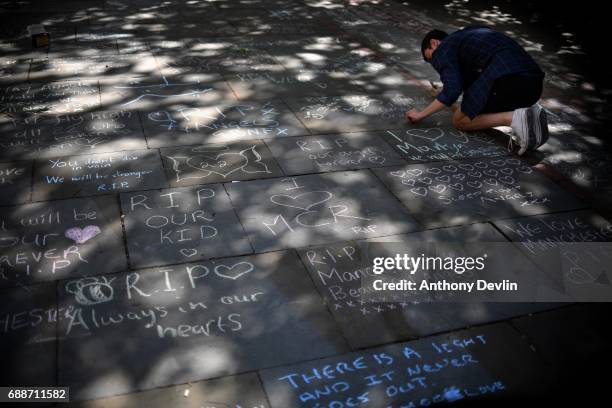 Messages of support are written in chalk in Saint Ann's Square in tribute to those killed in an explosion at the Manchester Arena earlier this week...