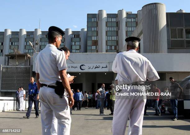 Egyptian police stand guard outside a hospital in Cairo's northern suburb of Shubra on May 26 following an attack in which 28 Coptic pilgirms were...