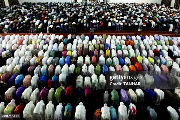 Indonesian Muslims pray during the start of the holy month of Ramadan on May 26, 2017 in Padang, West Sumatra province. More than 1.5 billion Muslims...