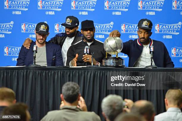 Kevin Love, Tristan Thompson, LeBron James and J.R. Smith of the Cleveland Cavaliers talk to the media during a press conference after winning Game...