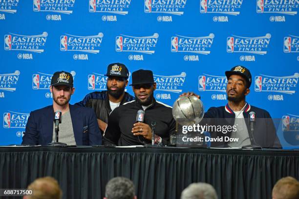 Kevin Love, Tristan Thompson, LeBron James and J.R. Smith of the Cleveland Cavaliers talk to the media during a press conference after winning Game...