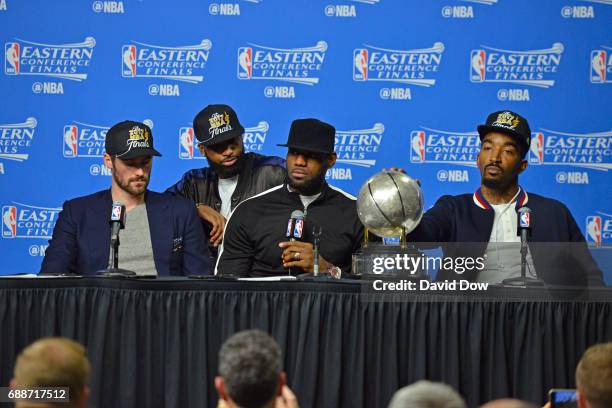 Kevin Love, Tristan Thompson, LeBron James and J.R. Smith of the Cleveland Cavaliers talk to the media during a press conference after winning Game...