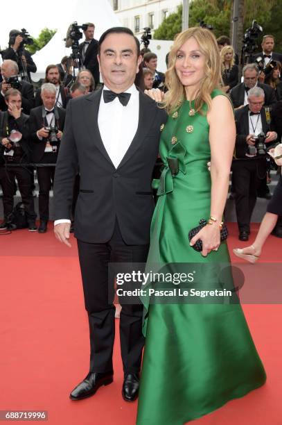 Renault CEO Carlos Ghosn and his wife Carole Ghosn attend "Amant Double " Red Carpet Arrivals during the 70th annual Cannes Film Festival at Palais...