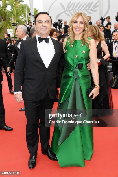 Renault CEO Carlos Ghosn and his wife Carole Ghosn attend "Amant Double " Red Carpet Arrivals during the 70th annual Cannes Film Festival at Palais...