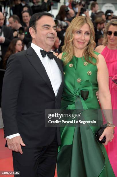 Renault CEO Carlos Ghosn and his wife Carole Ghosn attend "Amant Double " Red Carpet Arrivals during the 70th annual Cannes Film Festival at Palais...