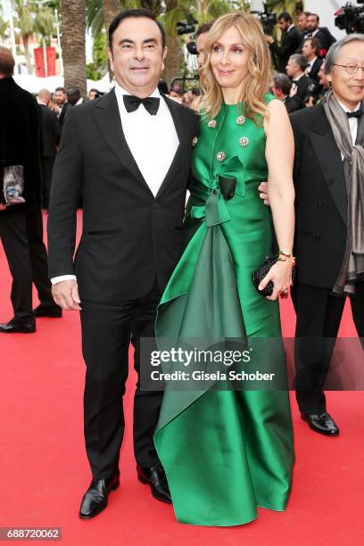 Renault CEO Carlos Ghosn and his wife Carole Ghosn attend "Amant Double " Red Carpet Arrivals during the 70th annual Cannes Film Festival at Palais...