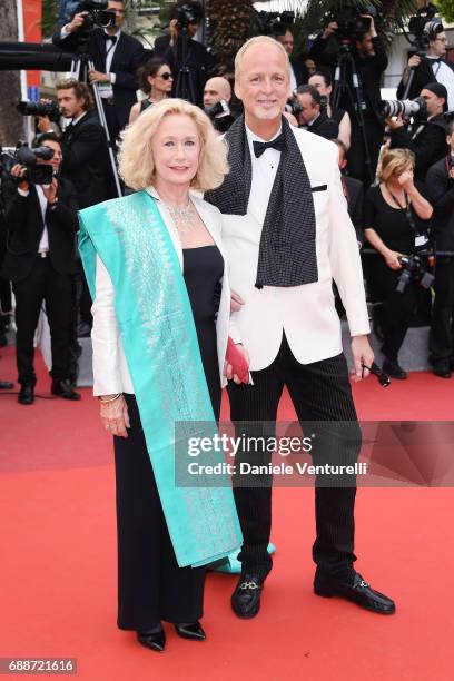 Brigitte Fossey and Larry Cech attend "Amant Double " Red Carpet Arrivals during the 70th annual Cannes Film Festival at Palais des Festivals on May...