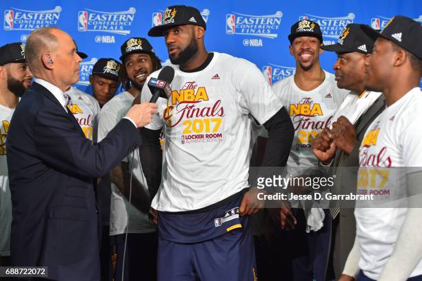 Analyst, Ernie Johnson interviews LeBron James of the Cleveland Cavaliers during the photo shoot after winning Game Five of the Eastern Conference...