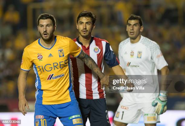Andre Gignac of Tigres, Osvaldo Alanis of Chivas and Nahuel Guzman of Tigres gesture during the Final first leg match between Tigres UANL and Chivas...