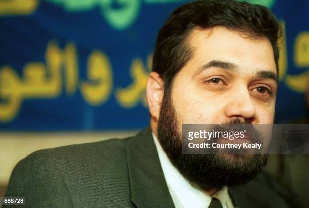 Usama Hamdan, the Hamas representative in Lebanon, speaks to Hamas supporters December 21, 2001 in a meeting room in the Palestinian refugee camp,...