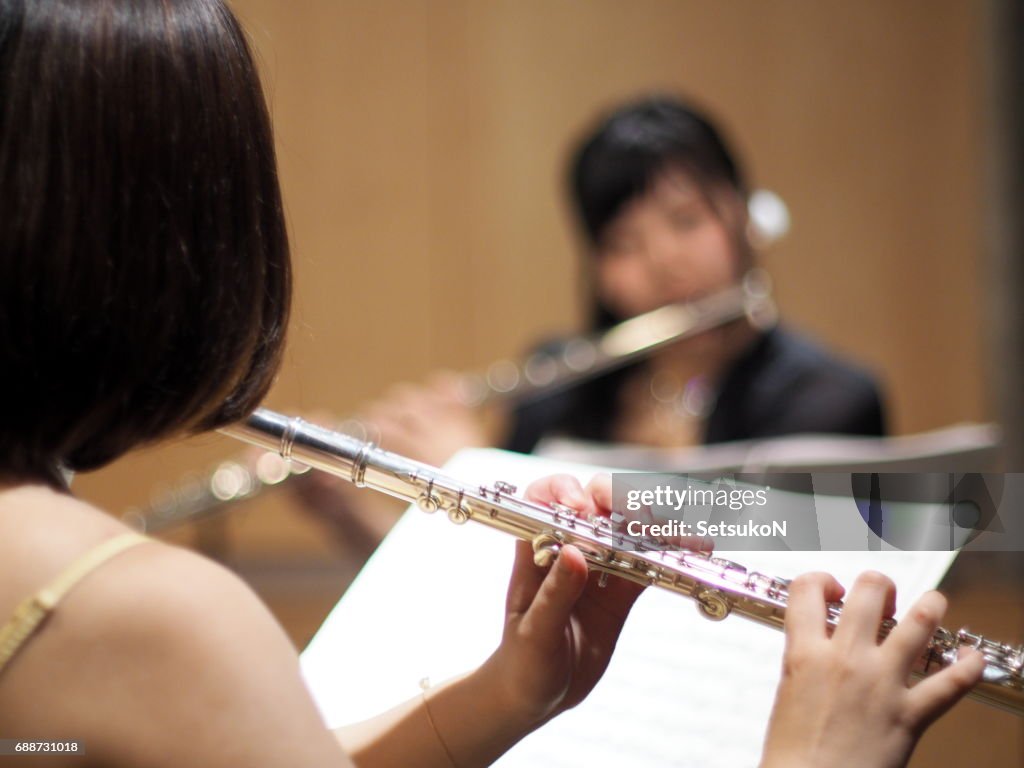 Close Up of a Woman Playing a Flute