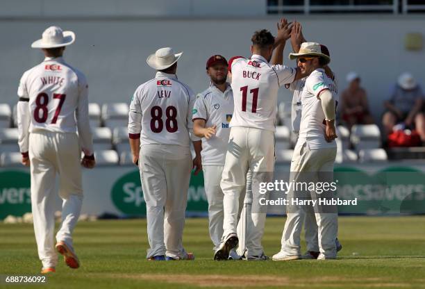 Nathan Buck of Northamptonshire celebrates with team mates the wicket of Brett D'Oliveria of Worcestershire during the Specsavers County Championship...