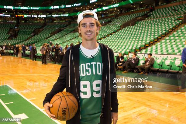 French professional footballer, Antoine Griezmann poses for a photo on the court prior to Game Five between the Cleveland Cavaliers and Boston...