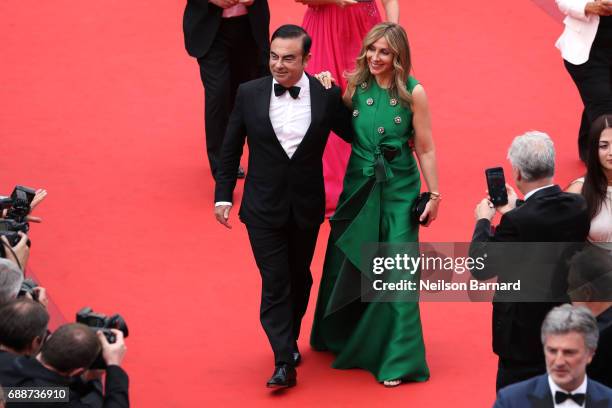 Renault CEO Carlos Ghosn and his wife Carole Ghosn attend "Amant Double " Red Carpet Arrivals during the 70th annual Cannes Film Festival at Palais...