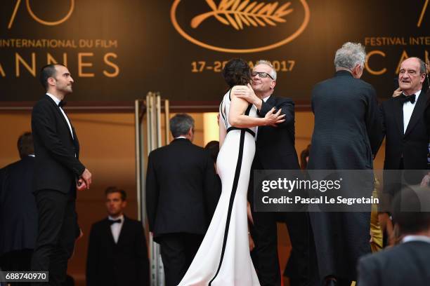 Juliette Binoche and festival director Thierry Fremaux attend the "Amant Double " premiere during the 70th annual Cannes Film Festival at Palais des...