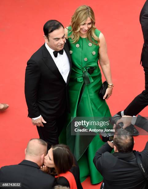 Renault CEO Carlos Ghosn and Carole Ghosn attend the "Amant Double " screening during the 70th annual Cannes Film Festival at Palais des Festivals on...