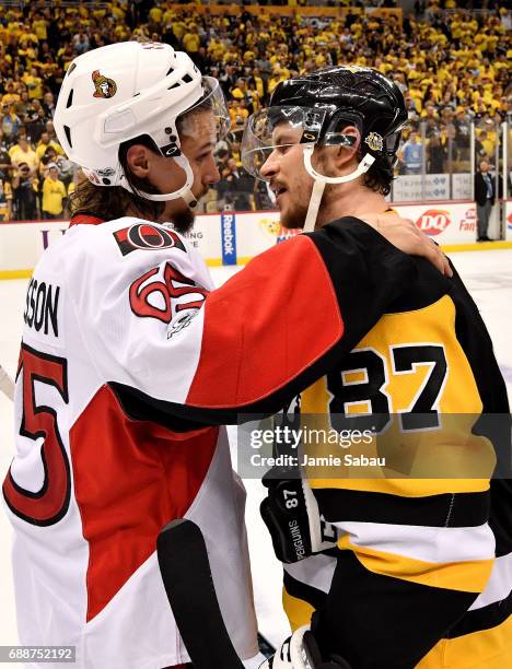 Erik Karlsson of the Ottawa Senators congratulates Sidney Crosby of the Pittsburgh Penguins after winning Game Seven of the Eastern Conference Final...