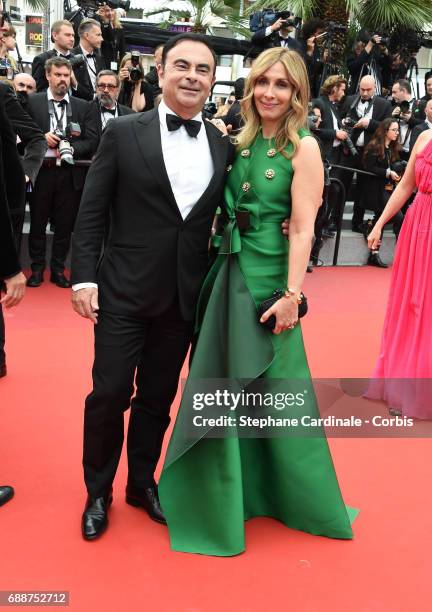 Renault CEO Carlos Ghosn and Carole Ghosn attend the "Amant Double " premiere during the 70th annual Cannes Film Festival at Palais des Festivals on...