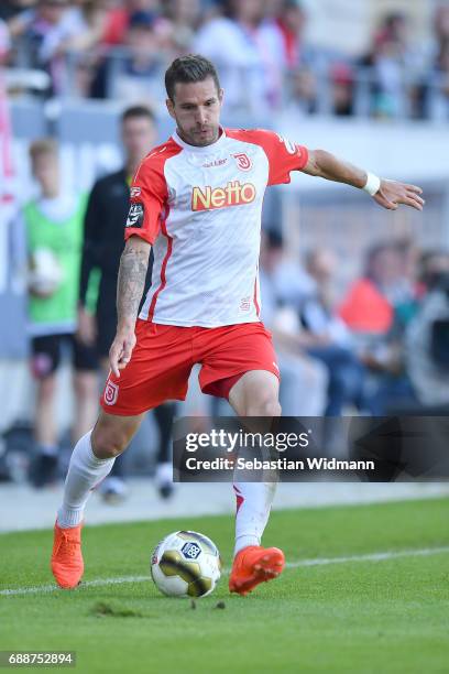 Marco Gruettner of Jahn Regensburg plays the ball during the Second Bundesliga Playoff first leg match between Jahn Regensburg and TSV 1860 Muenchen...